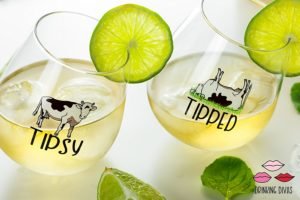 tipsy and tipped stemless wine glasses with cows