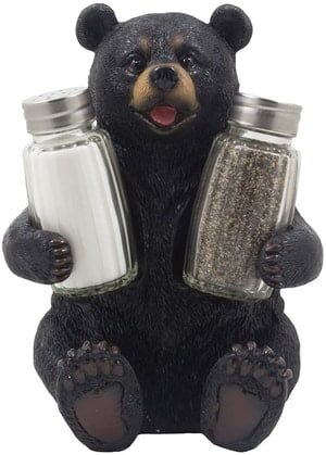 large bear cradling salt and pepper shakers