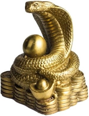 brass cobra and coins statue