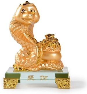 golden cobra with money bag statue