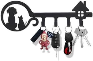 DOG AND cat featured on key holder shaped like large key. holds 4.