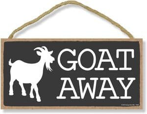 small hanging sign with "Goat Away" in Clurier font and A goat in silhouette on a black background